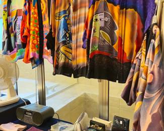 Dramatic silk shirts with artsy designs not usually seen in an estate sale. Styles are roomy and run large and will fit 12-14-16+