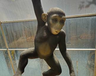 Whimsical composition, weatherproof lifesize monkey