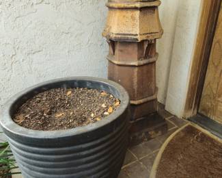 Large dark blue pot and one of two European chimney tops with crown tops
