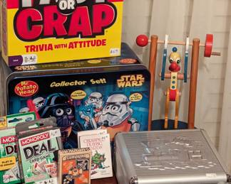 Games: Fact or Crap, Star Wars Mr. Potato Head, Monopoly Deal Card games, Survival Mental Attitude card game, Mexican Train dominoes in case