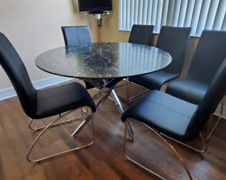 Dinette with 6 leather chairs.