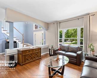 Living Room featuring Leather Furniture and Occasional Tables.