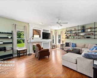 Open Family Room with Sectional Sofa, Leather Recliner and Decor