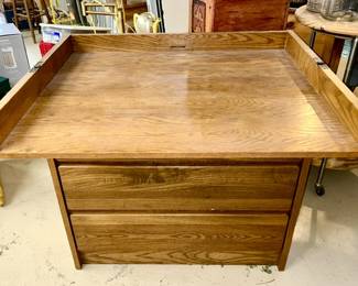 Top view of hinged top changing table with 3 drawers