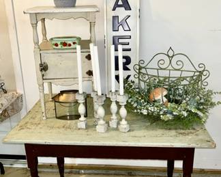 Antique wooden table, antique smoke stand (sold), baskets, metal flower modern bakery, sign, etc.