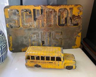 Old school bus sign and toy bus