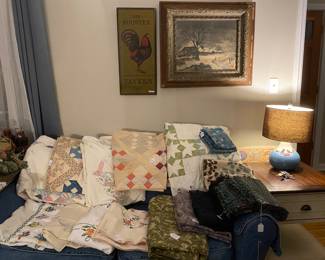 Many vintage quilts, embroidered table cloths, curtains, pillows etc