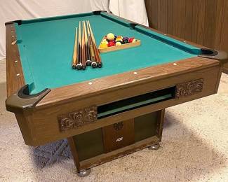 Pool Table with Pool Sticks, Cue Ball, and Object Balls