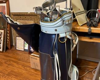 Blue golf bag includes all Woods; Irons and putters