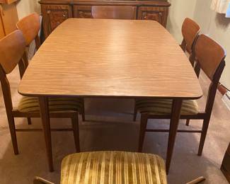 Great MCM dining table with six chairs. 