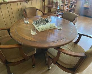 Game table with four rolling chairs. 