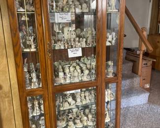 Three curio cabinets full of Precious Moments. 
