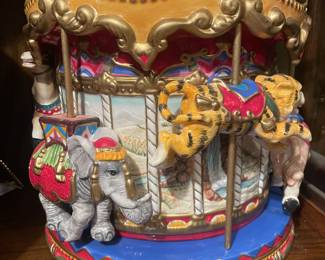Stunning Fitz and Floyd carousel cookie jar.  Different animals ride the carousel. 