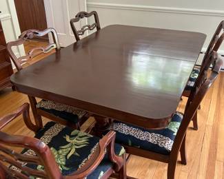 Mahogany Double Pedestal Dining Table with three 12" leaves. 42" W x 62" L x 30" H  Can seat 10-12 people.