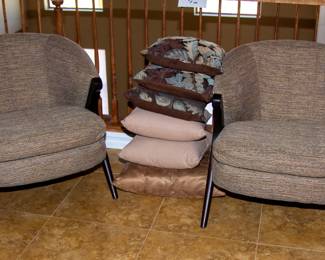 Plush matching chairs and decorative pillows