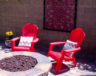Matching red chairs and outdoor artwork