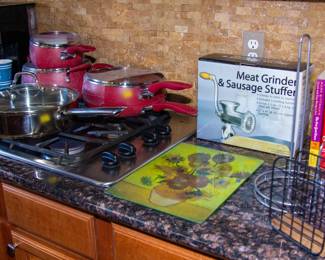 Assortment of kitchen appliances, pots and pans