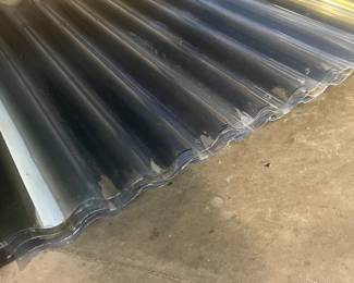 Plastic corrugated roof covering