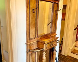 THIS HALL TREE IS AN ANTIQUE BEAUTY.  NOTICE THE ROOM FOR UMBRELLAS AND CANES.