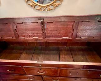 TOP LIFTS WITH DUMMY DRAWERS THAT LOCK.  OTHER DRAWERS OPEN.