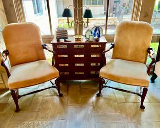 ANTIQUE APOTHECARY CHEST WITH A PAIR OF VINTAGE GOOSENECK PIGSKIN UPHOLSTERED ARM CHAIRS.