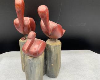 Carved pelicans on pier