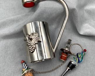 Wine bottle carry holder and stoppers