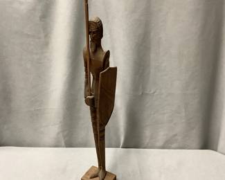 Wooden hand carved Spanish Guard sculpture with exaggerated thinness