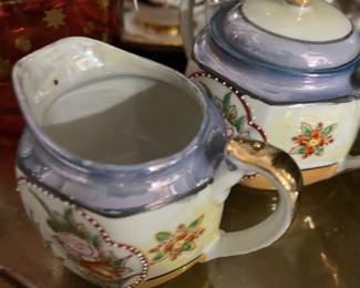 Japanese lusterware cream and sugar . 1930