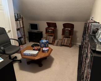 Media room filled with CDs VHS stereo Mid century, coffee, table games, etc.