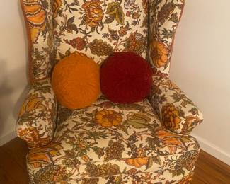 vintage wing back chair with vintage pillows