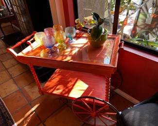 This is the cutest tea cart painted the best bright orange color!