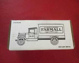 Farmall toy bank, new in box