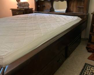 Water bed frame. Use the curtain mattress or purchase a bladder and relive the 70’s!