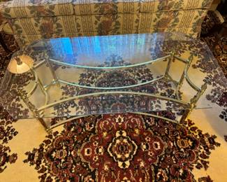 Brass and glass coffee table with clean sleek lines