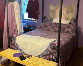 Very cute canopy bed with purple or white canopy curtains