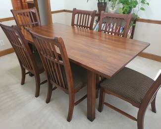 STUNNING ASHLEY DINING TABLE LIKE NEW WITH 6 CHAIRS-THIS IS SOLID AND WHAT I LOVE ABOUT IT IS THAT IT IS SLIGHTLY NARROWER THAN MOST TABLES FOR A BETTER FIT FOR MOST ROOMS. OUR PRICE $200