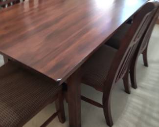 STUNNING ASHLEY DINING TABLE LIKE NEW WITH 6 CHAIRS-THIS IS SOLID AND WHAT I LOVE ABOUT IT IS THAT IT IS SLIGHTLY NARROWER THAN MOST TABLES FOR A BETTER FIT FOR MOST ROOMS. OUR PRICE $200