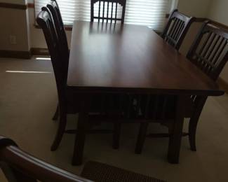 STUNNING ASHLEY DINING TABLE LIKE NEW WITH 6 CHAIRS-THIS IS SOLID AND WHAT I LOVE ABOUT IT IS THAT IT IS SLIGHTLY NARROWER THAN MOST TABLES FOR A BETTER FIT FOR MOST ROOMS. OUR PRICE $200