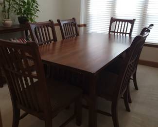 STUNNING ASHLEY DINING TABLE LIKE NEW WITH 6 CHAIRS-THIS IS SOLID AND WHAT I LOVE ABOUT IT IS THAT IT IS SLIGHTLY NARROWER THAN MOST TABLES FOR A BETTER FIT FOR MOST ROOMS. OUR PRICE $200