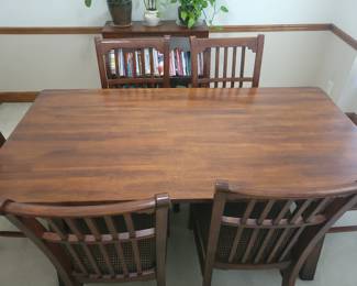 STUNNING ASHLEY DINING TABLE LIKE NEW WITH 6 CHAIRS-THIS IS SOLID AND WHAT I LOVE ABOUT IT IS THAT IT IS SLIGHTLY NARROWER THAN MOST TABLES FOR A BETTER FIT FOR MOST ROOMS. OUR PRICE $200