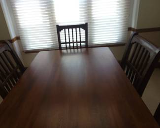 STUNNING ASHLEY DINING TABLE LIKE NEW WITH 6 CHAIRS-THIS IS SOLID AND WHAT I LOVE ABOUT IT IS THAT IT IS SLIGHTLY NARROWER THAN MOST TABLES FOR A BETTER FIT FOR MOST ROOMS. OUR PRICE $200