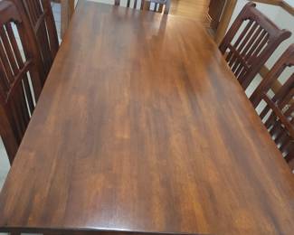 STUNNING ASHLEY DINING TABLE LIKE NEW WITH 6 CHAIRS-THIS IS SOLID AND WHAT I LOVE ABOUT IT IS THAT IT IS SLIGHTLY NARROWER THAN MOST TABLES FOR A BETTER FIT FOR MOST ROOMS. OUR PRICE $200
