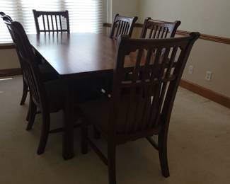 STUNNING ASHLEY DINING TABLE LIKE NEW WITH 6 CHAIRS-THIS IS SOLID AND WHAT I LOVE ABOUT IT IS THAT IT IS SLIGHTLY NARROWER THAN MOST TABLES FOR A BETTER FIT FOR MOST ROOMS. OUR PRICE $200