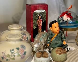 Japanese  Wind Bell on the right.  Chinese Oil Lamps on the left. Chinese Man Jointed Doll. Silver Pig Trinket box