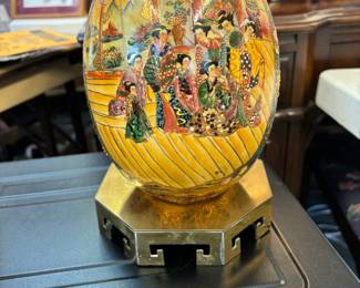 Beautifully Hand painted egg with brass stand