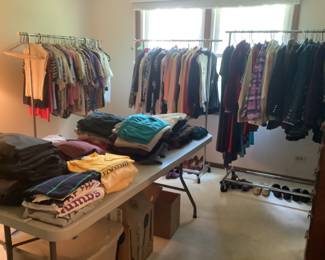 Room full of clothes, shoes, slacks and pants, 