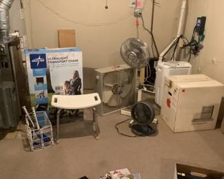 Wheelchair, bath chair, three styles of fans, and vintage apple computer box