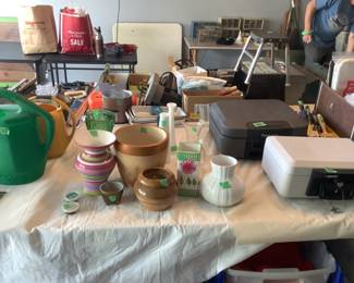 Garage items include vases and long handled tools