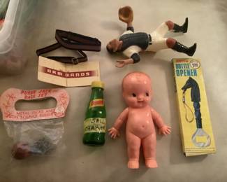 Purse Jacks, Kewpie doll, arm bands, Squirt salt shaker and Yogi Berra  Hartland plastic player, opener
